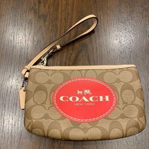 brown and red coach wristlet
